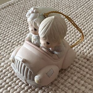 Precious Moments our first Christmas together ornament.  Dated  1990.